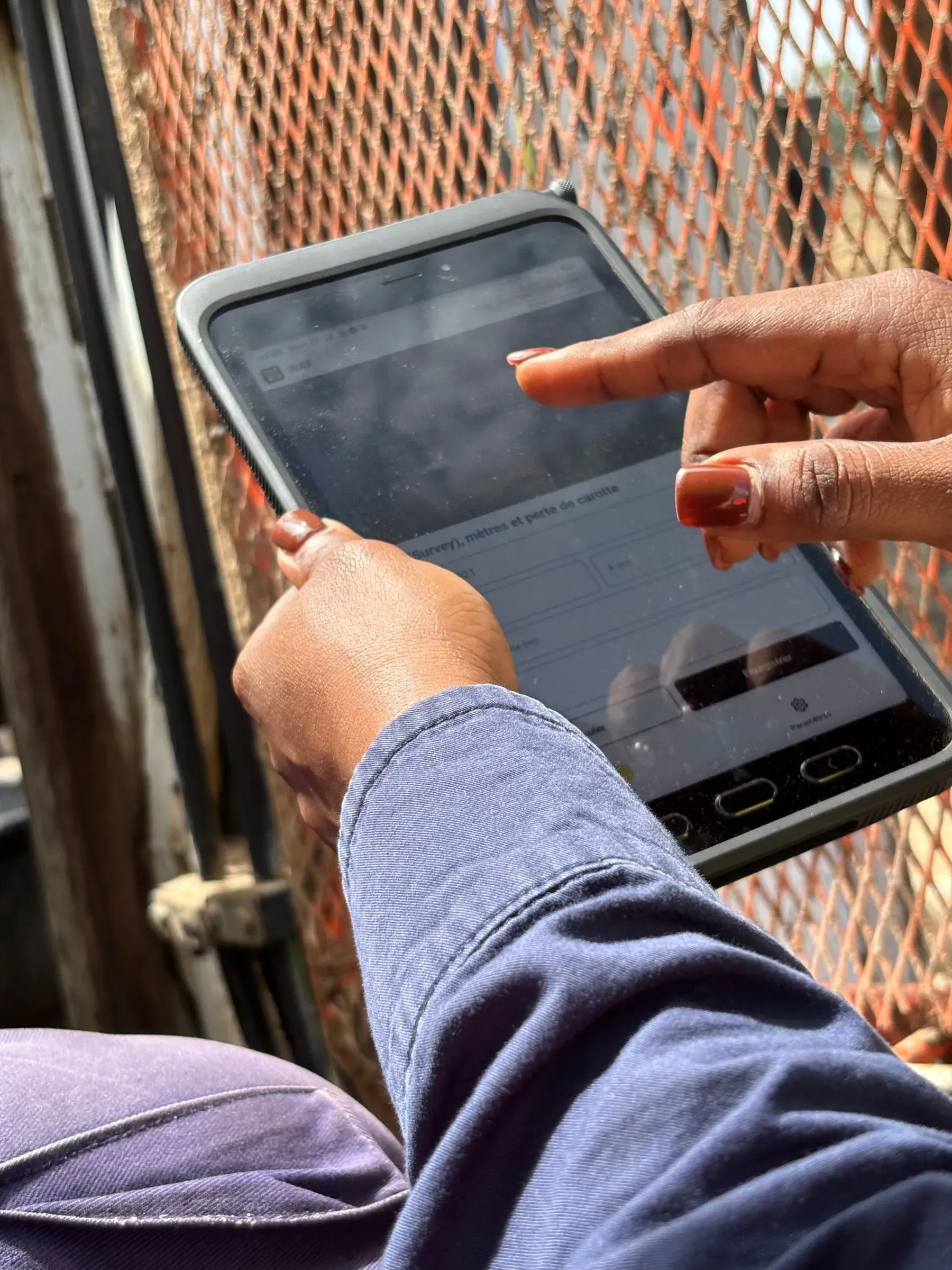A driller types depths and core loss on the rugged tablet